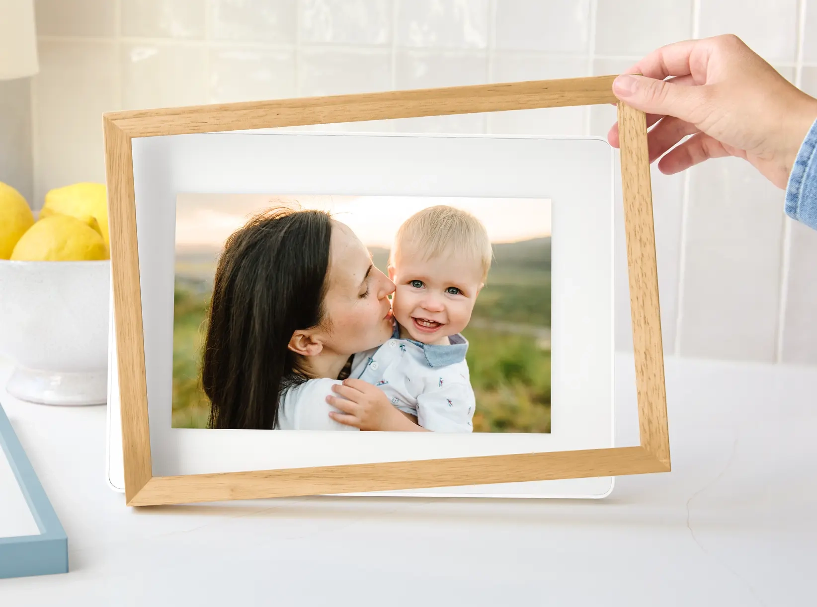 Skylight Calendar 15" on a countertop with a plant and bookcase in the background